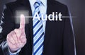 Businessman touching audit button