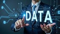 Businessman touching digital DATA hologram in futuristic interface. Royalty Free Stock Photo