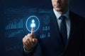 Businessman touching a digital interface displaying charts and user icons suit Royalty Free Stock Photo