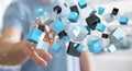 Businessman touching floating blue shiny cube network 3D rendering Royalty Free Stock Photo