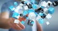 Businessman touching floating blue shiny cube network 3D rendering Royalty Free Stock Photo