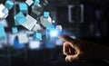 Businessman touching floating blue shiny cube network 3D rendering Royalty Free Stock Photo