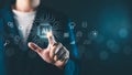 A businessman touching a glowing AI chip icon with digital network symbols, representing artificial intelligence, technology Royalty Free Stock Photo