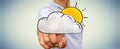 Businessman touching hand drawn cloud and sun icons