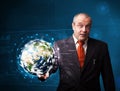 Businessman touching high-tech 3d earth panel Royalty Free Stock Photo