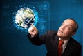 Businessman touching high-tech 3d earth panel Royalty Free Stock Photo