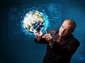Businessman touching high-tech 3d earth panel Royalty Free Stock Photo