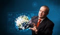 Businessman touching high-tech 3d earth panel Royalty Free Stock Photo