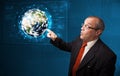 Businessman touching high-tech 3d earth panel Royalty Free Stock Photo