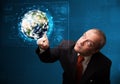 Businessman touching high-tech 3d earth panel Royalty Free Stock Photo