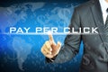 Businessman touching PAY PER CLICK on virtual screen Royalty Free Stock Photo