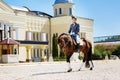 Businessman training before taking part in big annual horseracing festival Royalty Free Stock Photo