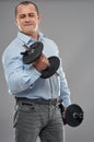 Businessman training with weights Royalty Free Stock Photo