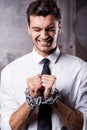 Businessman trapped in chains.