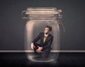 Businessman trapped into a glass jar concept Royalty Free Stock Photo