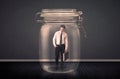 Businessman trapped into a glass jar concept Royalty Free Stock Photo