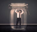 Businessman trapped into a glass jar concept Royalty Free Stock Photo