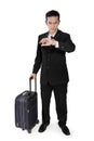 Businessman on trip checking time Royalty Free Stock Photo