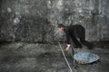 Businessman and turtle are ready to race on concrete floor