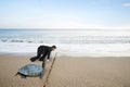 Businessman and turtle are ready to race on sand beach