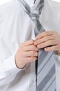 Businessman tying his tie