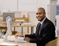 Businessman typing on computer at desk