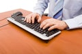 Businessman typing in the computer keyboard