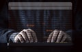 Businessman typing on computer keyboard with virtual monitor red error wording among binary code for notification error , Royalty Free Stock Photo
