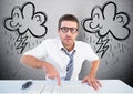 Businessman typing on desktop computer with lightning cloud in background Royalty Free Stock Photo