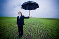 Businessman with umbrella Royalty Free Stock Photo