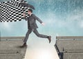 businessman with umbrella arraiving to the checker flag in a broken bridge