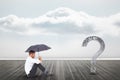 Businessman with umbrella looking at question mark on pier Royalty Free Stock Photo