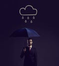 Businessman with umbrella standing under the rain. Dark, dramatic background. Business, failure, crisis, concept.