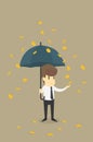 Businessman with Umbrella Standing Under the Rain of Golden Coin Royalty Free Stock Photo