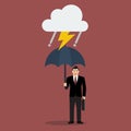 Businessman with umbrella in storm