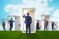 The businessman in uncertainty concept with many doors Royalty Free Stock Photo