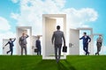 The businessman in uncertainty concept with many doors Royalty Free Stock Photo