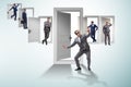 The businessman in uncertainty concept with many doors Royalty Free Stock Photo