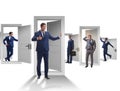 Businessman in uncertainty concept with many doors Royalty Free Stock Photo