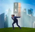 Businessman under heavy tax burden Royalty Free Stock Photo