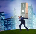 Businessman under heavy tax burden Royalty Free Stock Photo