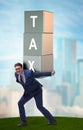 Businessman under heavy tax burden Royalty Free Stock Photo