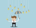 Businessman under Umbrella and rain bulb Idea