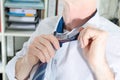 Businessman undoing his tie Royalty Free Stock Photo