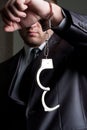 Businessman with unlocked handcuffs