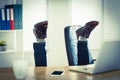 Businessman upside down at his desk Royalty Free Stock Photo