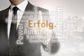 Businessman with urban background Erolg in german success word