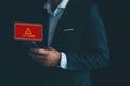 Businessman uses mobile phone with notification message, system hacker, cyber attack on mobile phone network, cyber security Royalty Free Stock Photo