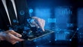 Businessman using tablet device for digital data analysis and visualization in modern office environment with graphs Royalty Free Stock Photo