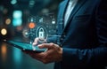 Businessman uses tablet showing security tech concepts. Data flow diagrams, security icons appear on screen. Digital protection
